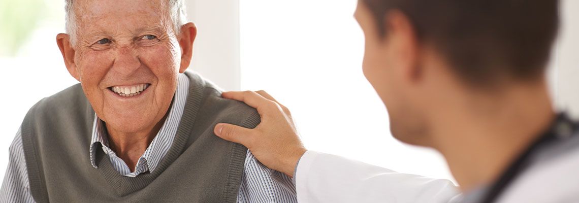 Happy veteran with doctor