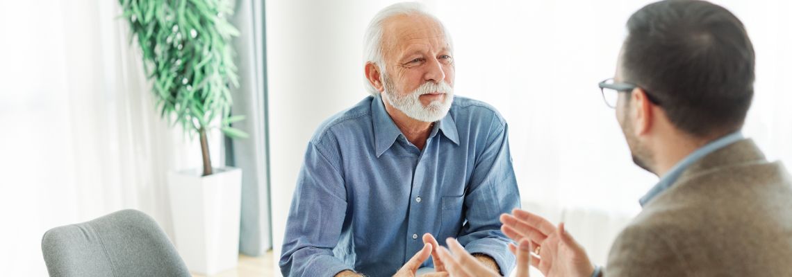 Old man consulting with attorney for estate planning