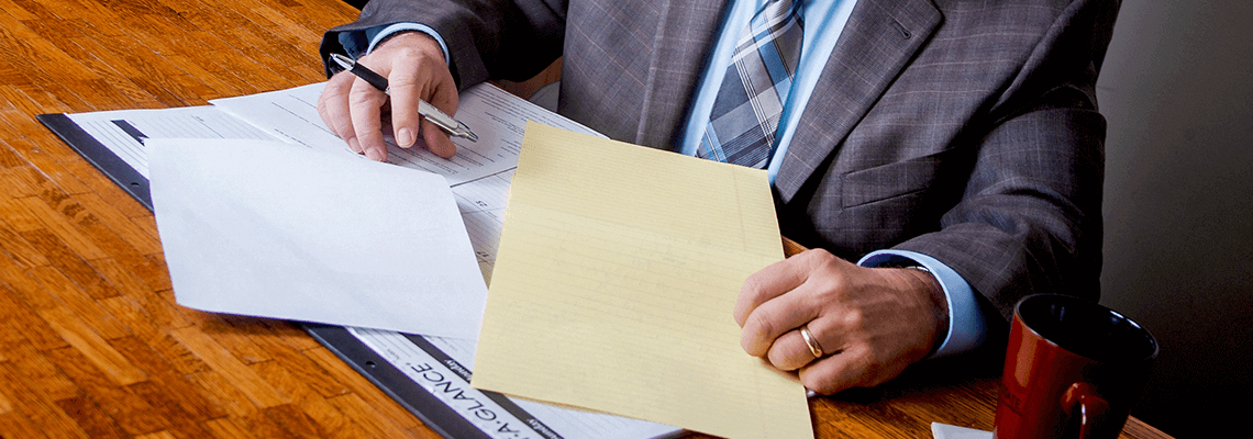 Man looking over papers