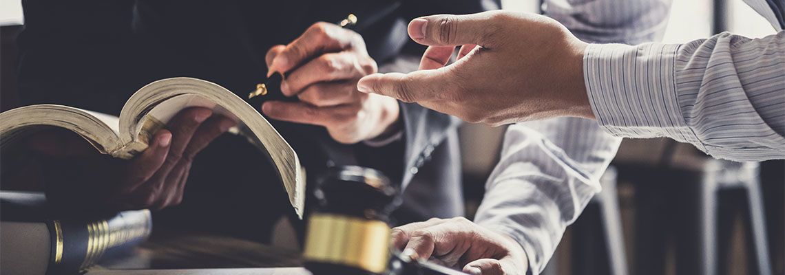 Businessman consulting with attorney