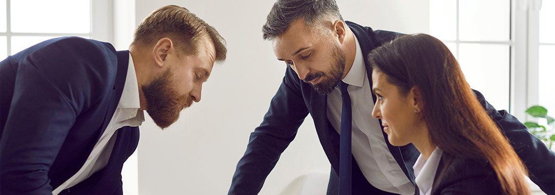 Businessmen counseling with attorney