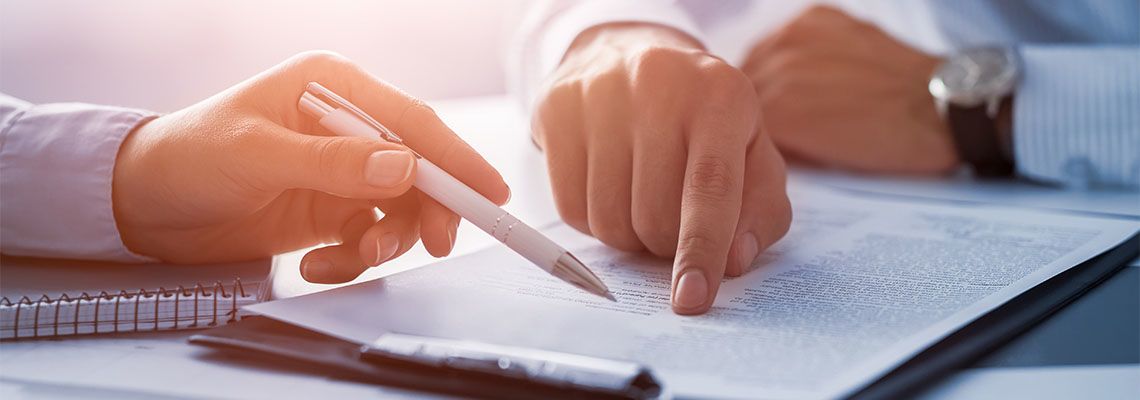 Business people negotiating a contract