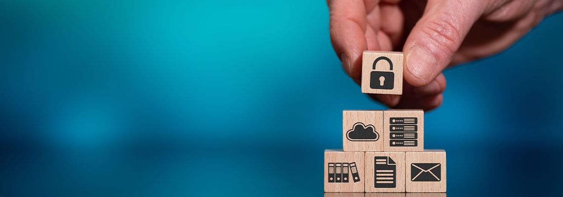 Symbols on wooden blocks representing data privacy