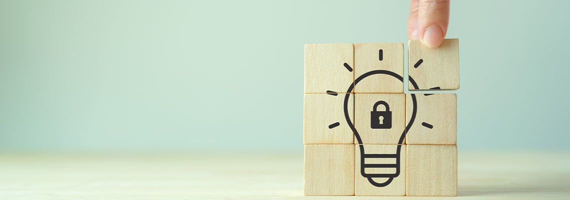 Cube with bulb and lock logo, Intellectual property protection concept