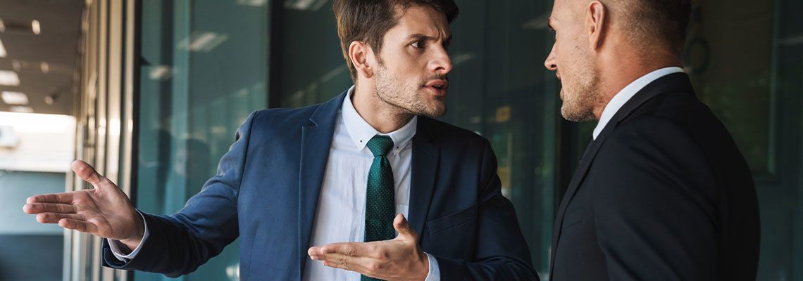 Business Partners arguing outside office