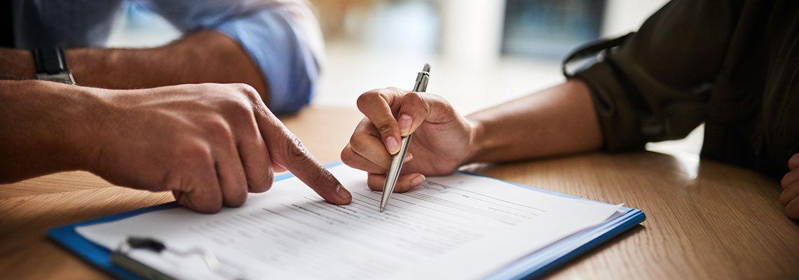 Employee signing contract document