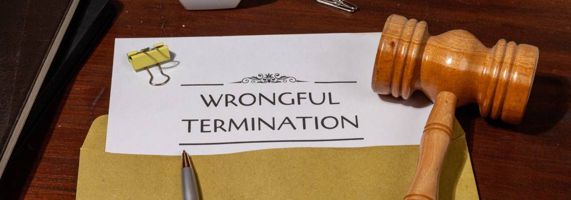 Document Detailing Wrongful Termination on Table with gavel