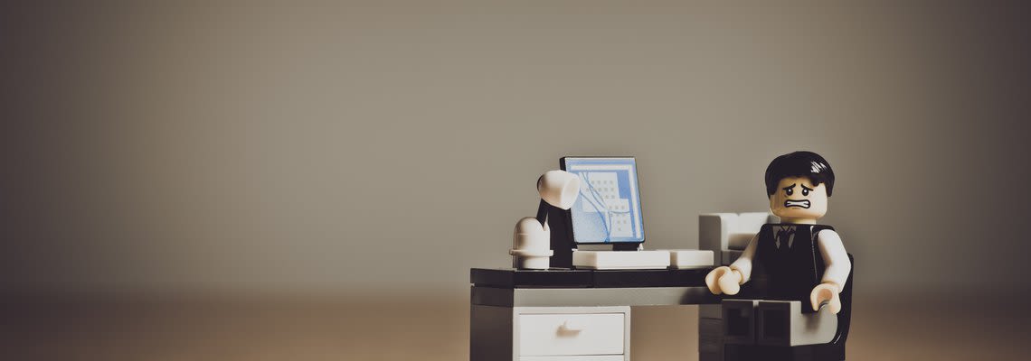 Stressed out lego man at a desk