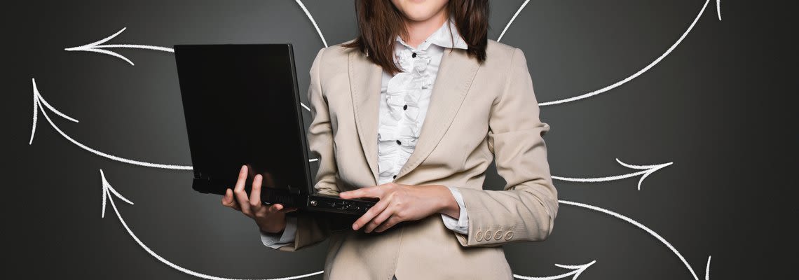 woman holding laptop