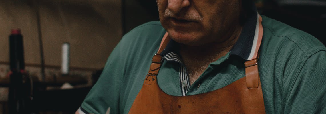 man in apron working