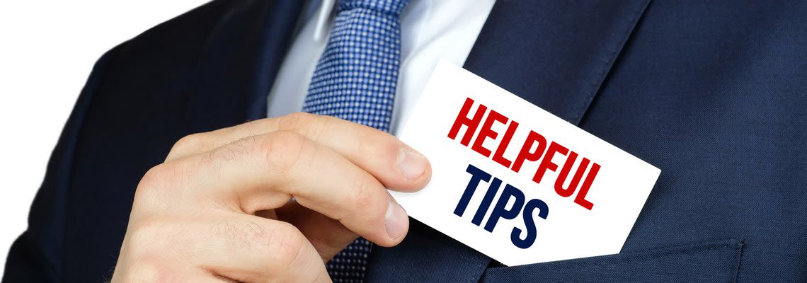 man removing helpful tips from his pocket