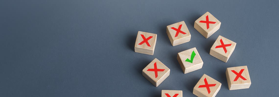 8 blocks with X and one block with a checkmark