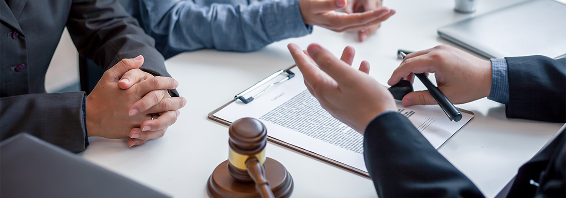 Businessman and Lawyer Discuss the Contract Document