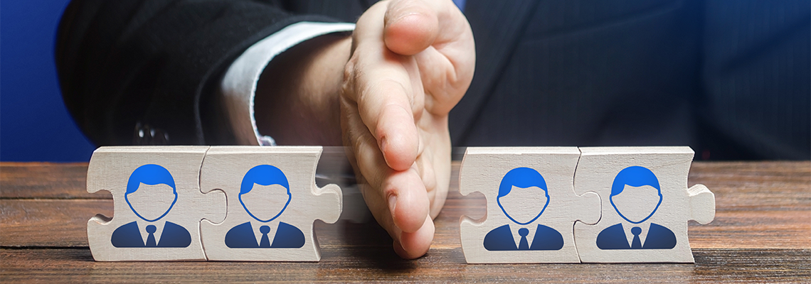 A man divides puzzle team of employees