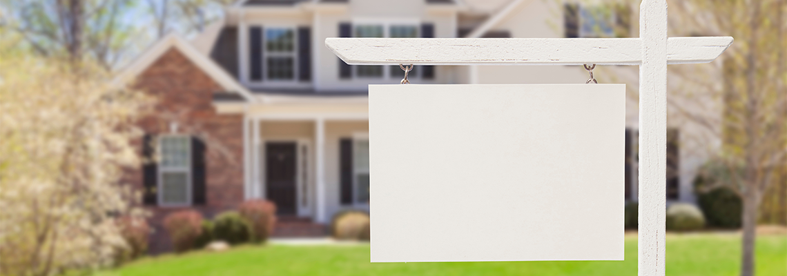 Blank Real Estate Sign in Front of New House