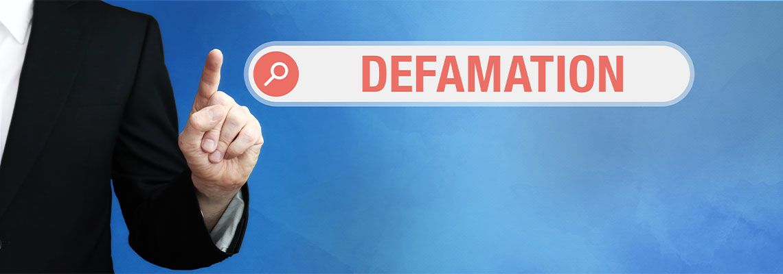 Man pointing finger to Defamation Text in search box