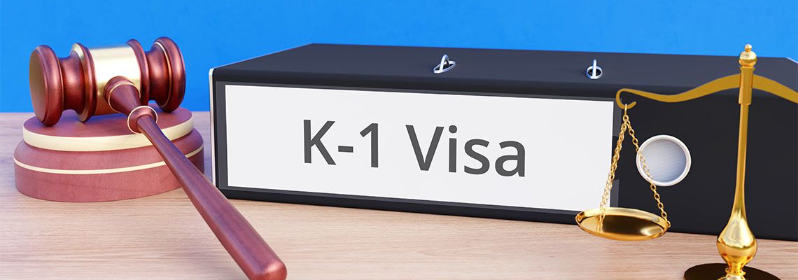 Folder with labeling K1 Visa and scale of justice