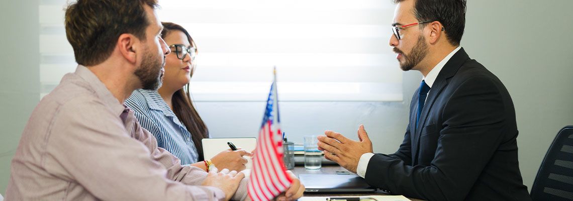 Couples discussing immigration legal advice with attorney