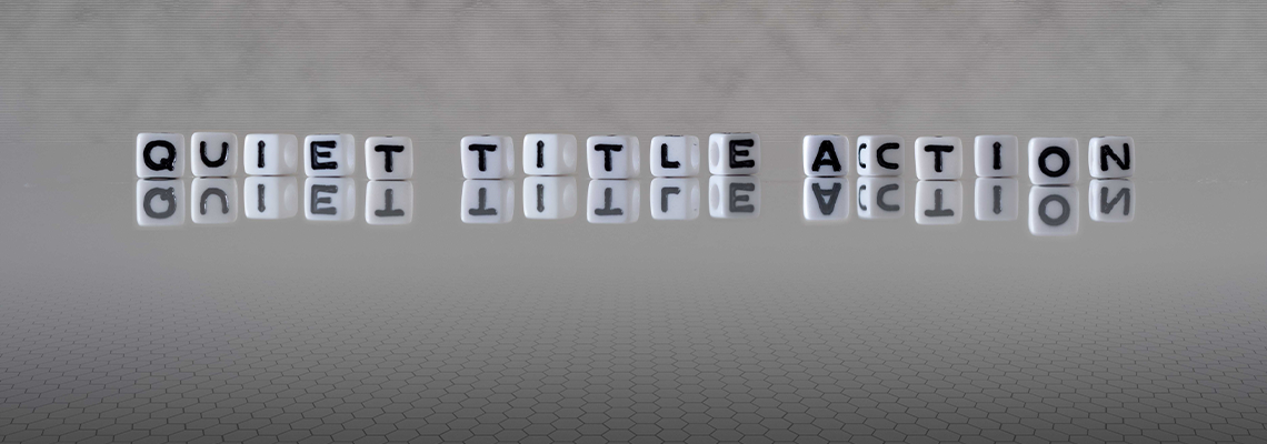 Quiet title action word or concept represented by black and white letter cubes