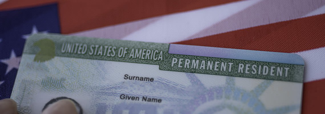 Green card on American flag
