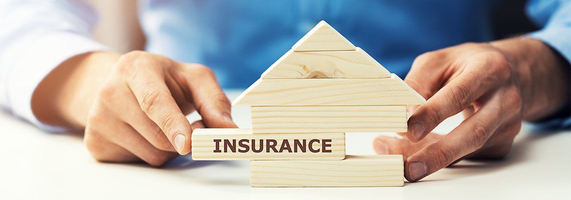 Insurance written on wooden house, Property Insurance Concept