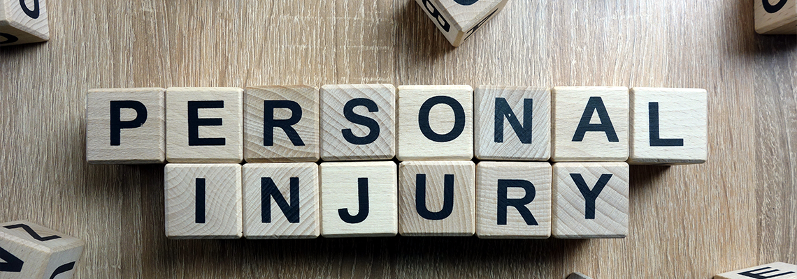 Personal Injury Text from Wooden Blocks on Desk