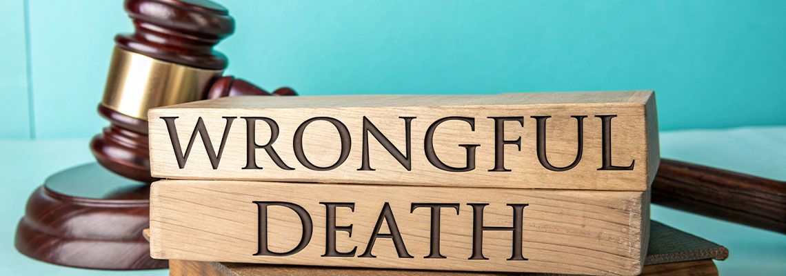 Wrongful Death words on wooden block and gavel on table