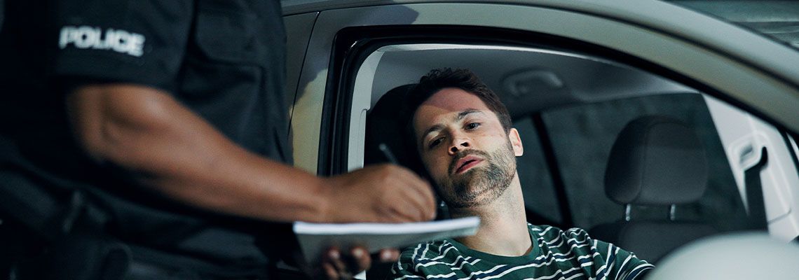 Man getting booked for traffic violations