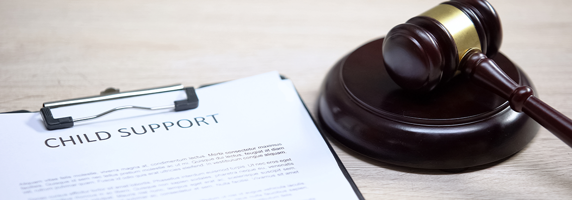 Child support document table, gavel lying on sound block, family law