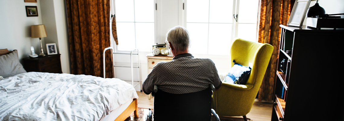 Senior man sitting on the wheelchair alone