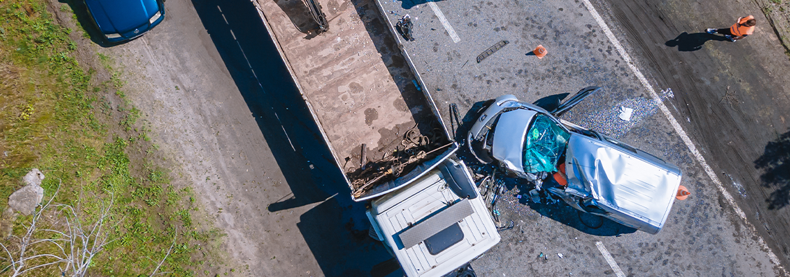 The truck and the car collided on the highway