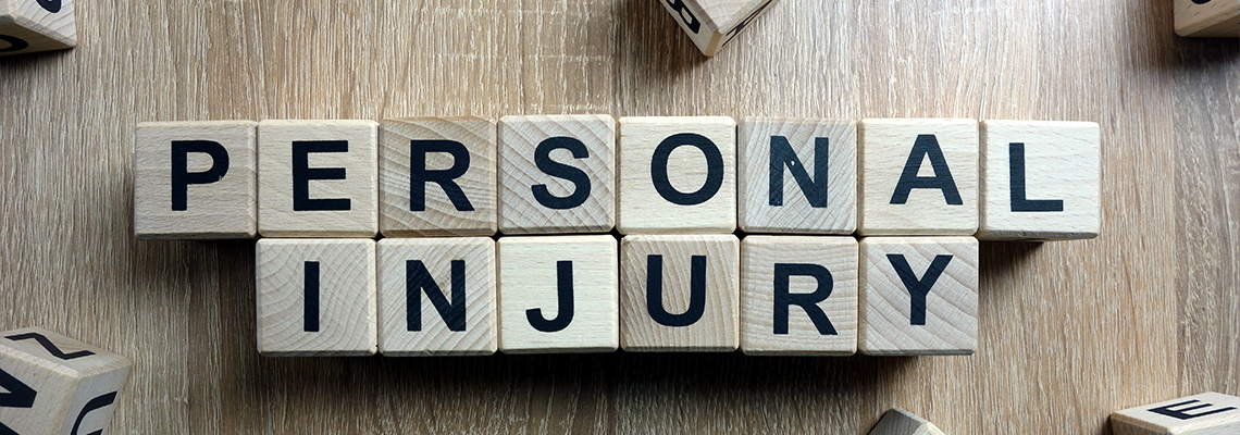 Personal Injury Text from Wooden Blocks on Desk