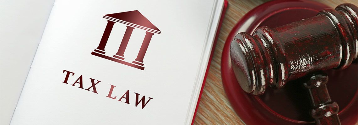 Open book with words tax law