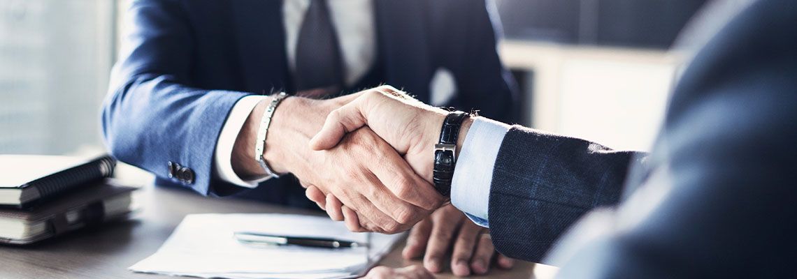 Businessmen shaking hands after agreement