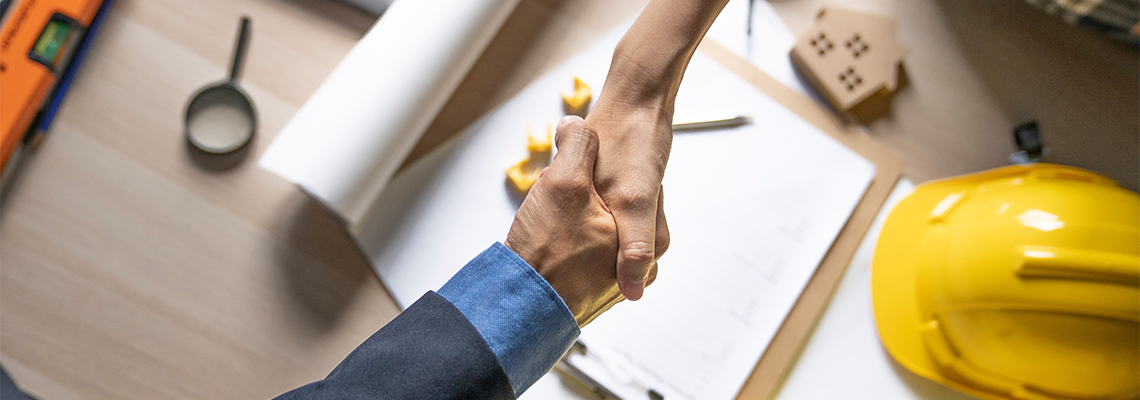 Shaking hands after architect build home finish