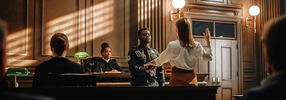 Women swearing on bible at courtroom
