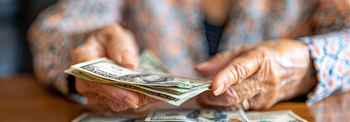Old women with dollar bills in her hand