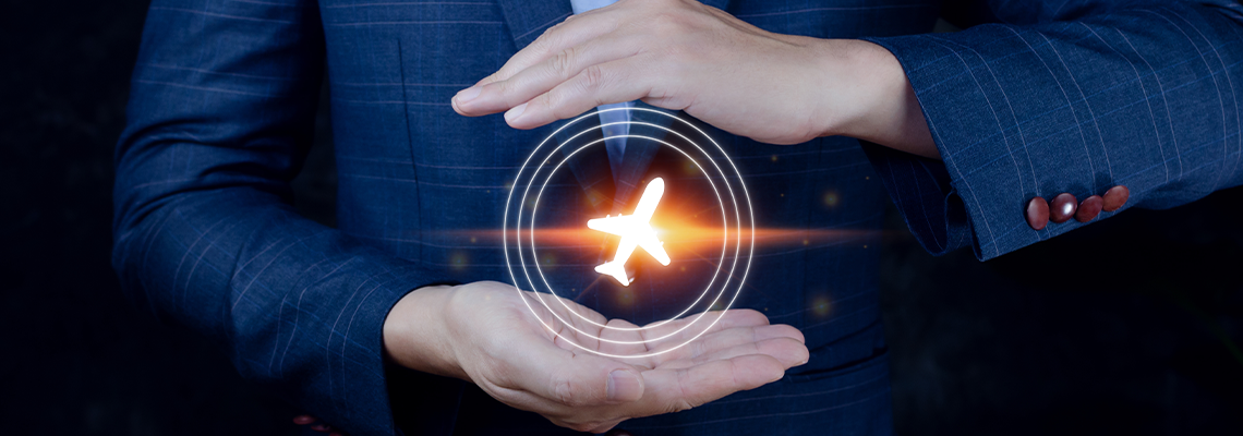 Businessman holding an plane airplane icon in his hands