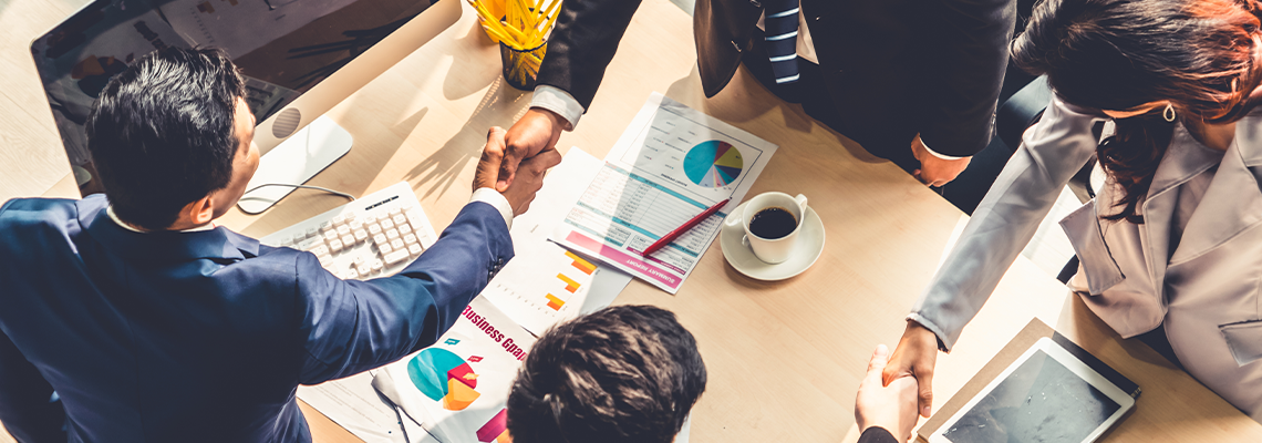 Group business people handshake at meeting table in office together