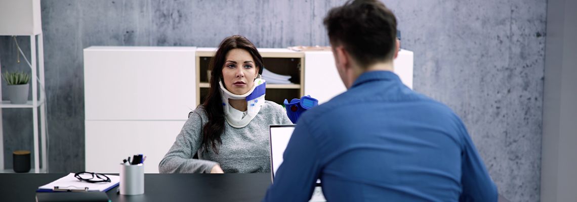 Injured women consulting with attorney