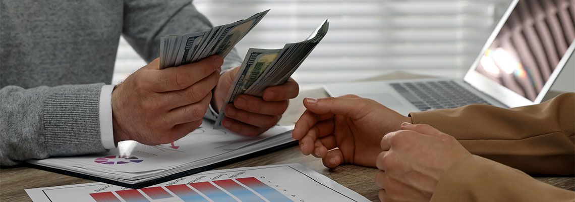 Man lending money to a woman