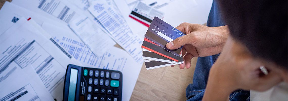 Man stressed about credit card debt and bills