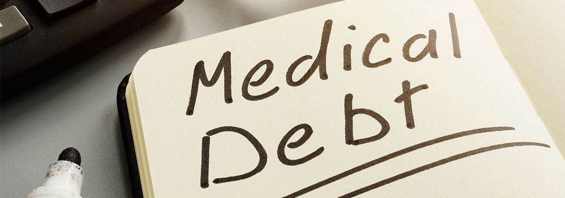 Medical Debt written by marker in notebook
