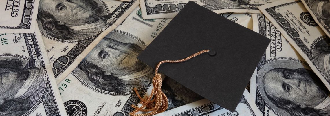 Graduation hat on dollar bills