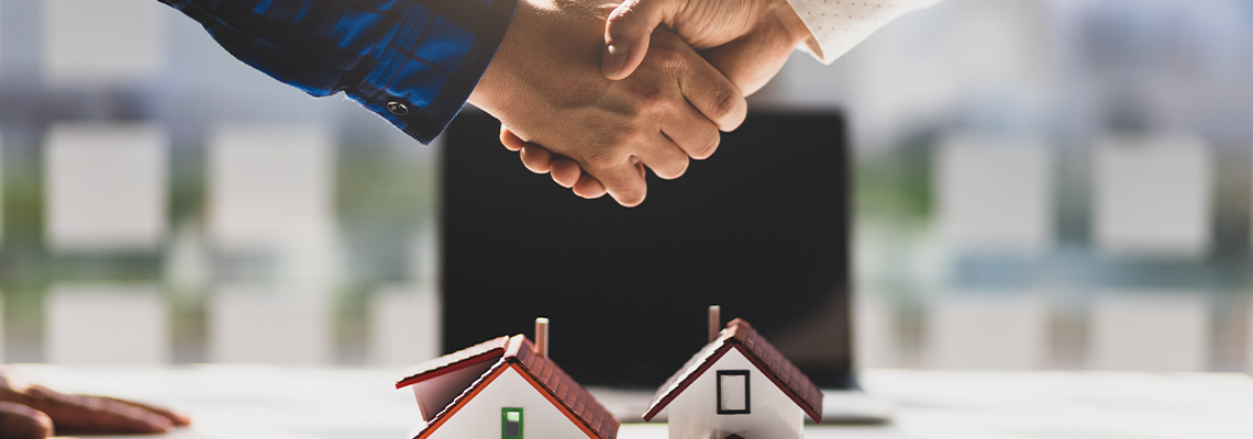 Real Estate Agents Shake Hands After the Signing of The Contract Agreement