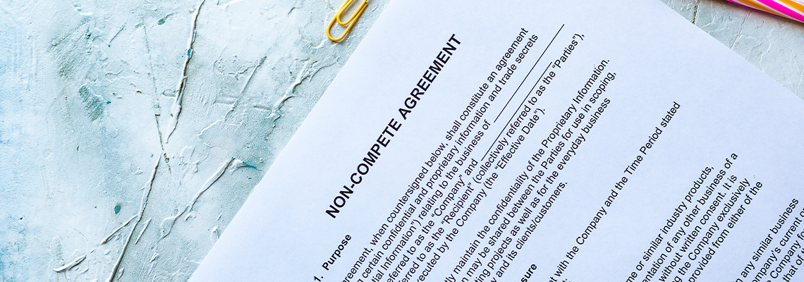 Non-Compete Agreement form and Pen on Table
