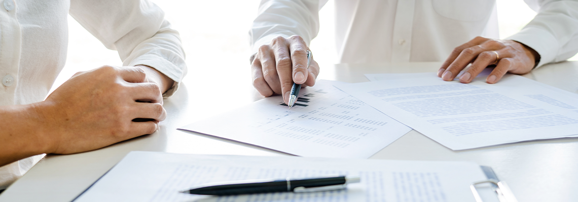Real Estate Agent broker or House developer showing contract