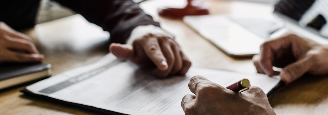 Client customer signing contract and discussing business with legal consultants