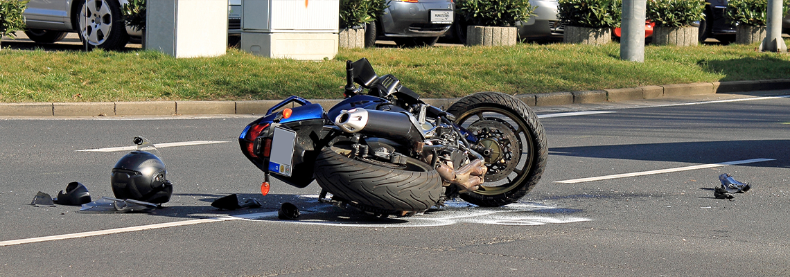 Motorcycle Crashed at Road with its Helmet