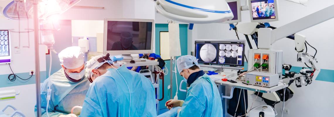 Surgeons working on a spinal surgery